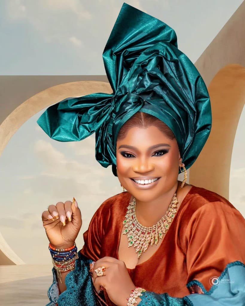 Wearables by Ashabi look styled with a statement necklace, earrings and teal gele